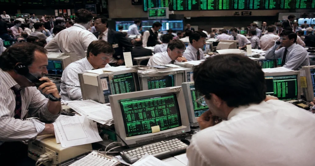 Day traders in the 1990s analyzing order flow screens during the soes trading era in nasdaq history.